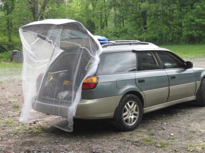 10. Barricade against bugs in the back by hanging mosquito netting over your open trunk.
