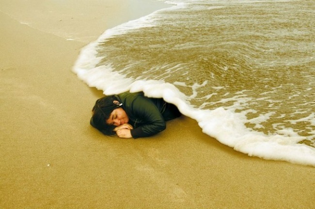 This lady lying under an ocean blanket