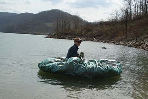 Wrapping a tarp around some logs can make a great makeshift raft. 