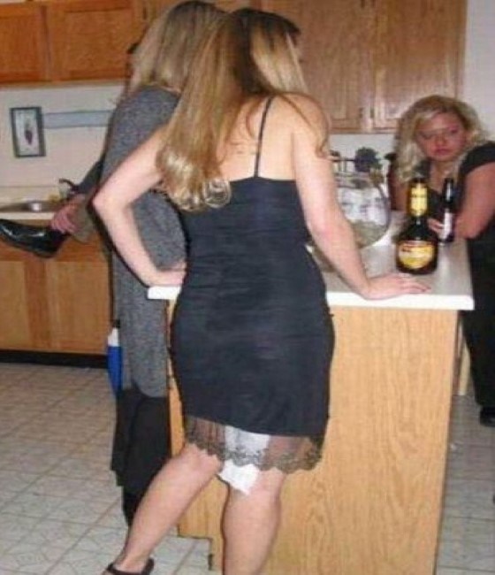 Doesn't anyone want to tell her that she has toilet paper hanging out of the back of her dress! She'll find out tomorrrow when she sees this photo on Facebook. Poor girl! 